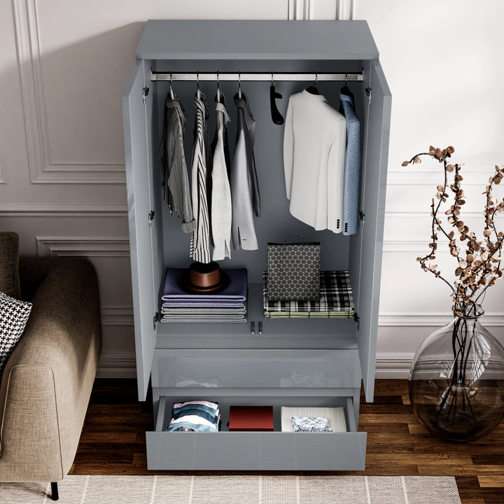 [Grey] open grey wardrobe from 3 piece set showing full-width hanging rail with clothes and bottom drawer.