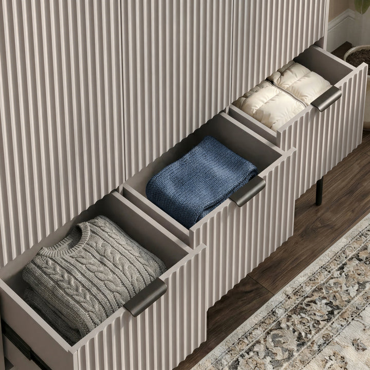 [Grey] wardrobe, lower three drawer unit partially open, displaying storage capacity and folded clothes neatly