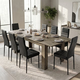 [Wooden Grey] Extended grey wood-effect dining table for 6-8 at dinner; eight black chairs surround its thick square legs.