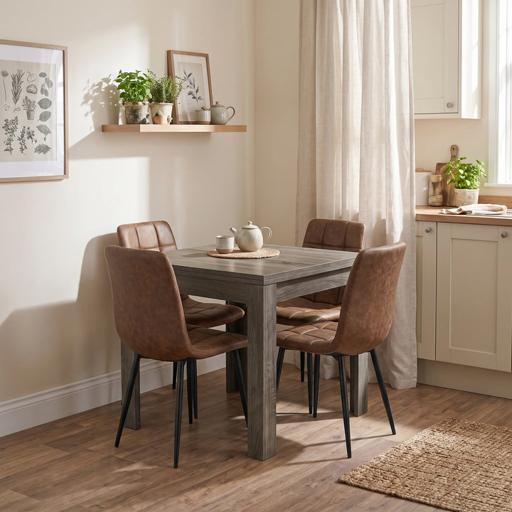 [Grey Wood] Closed flip-top dining table with four brown chairs and tea set in a bright open-plan kitchen diner