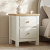 [White] 2 drawers nightstand with wooden top next to a bed in a bedroom setting