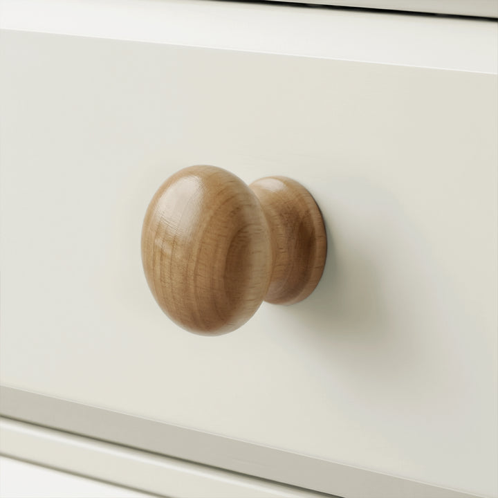 [White] Haven 3-drawer chest close-up of a single round wooden knob handle on a painted drawer front

