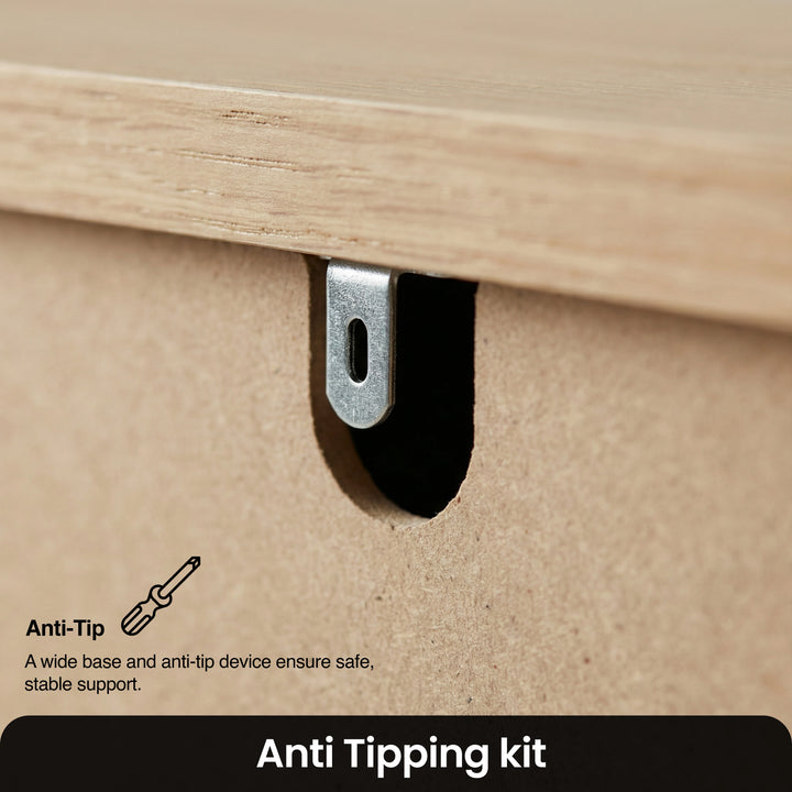 [White] Haven 3-drawer chest detail showing anti-tip wall safety bracket and oak veneer top edge close-up