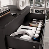 [Black] Top drawer of black High Gloss Chester Drawers showing storage of books, headphones, and accessories for multipurpose use.