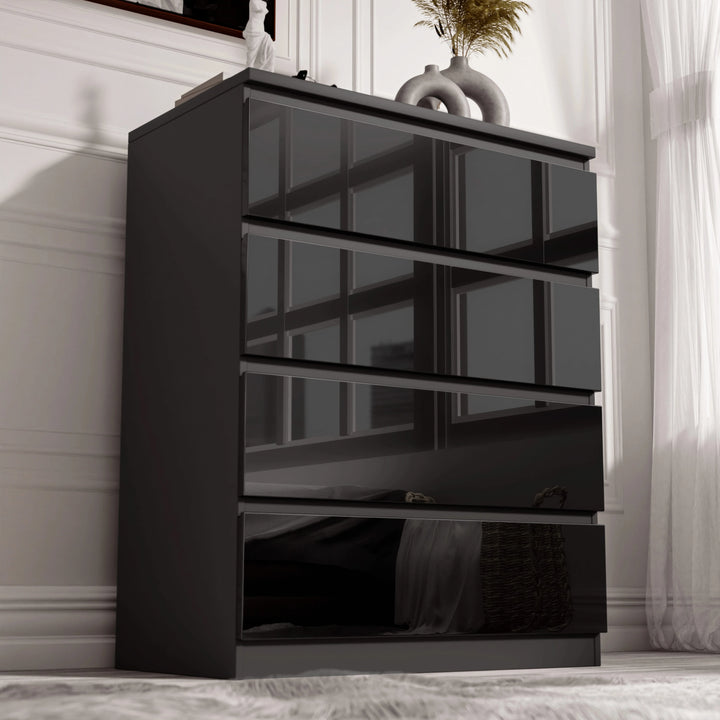 [Black] Angled view of the black High Gloss 4 Drawer Chest of Drawers, gloss fronts reflecting window panes vertically.