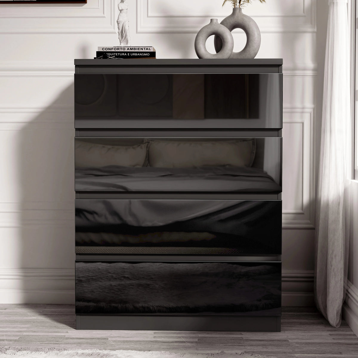 [Black] Black handleless 4 Drawer Chest of Drawers shot head-on against a panelled wall with the bed reflected.