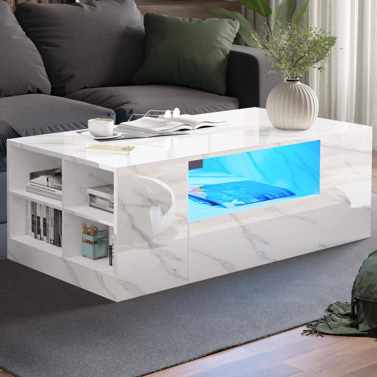 [White Marble] White marble coffee table between dark sofas, blue LED illuminating centre shelf with books on top