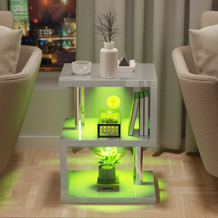 [Grey] Grey high gloss sofa side table between two cream armchairs with green LED glow on shelves at night