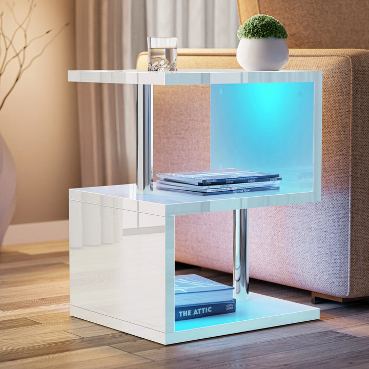 [White] White sofa side table angled shot showing top, middle and lower compartments beside upholstered sofa arm