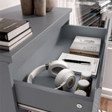 [White] Detail high gloss tall chest of drawers in grey with one drawer open over wood flooring