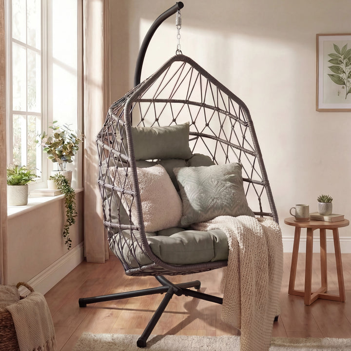 [Grey] Grey rattan egg chair on black stand in white living room with wooden side table and cream throw