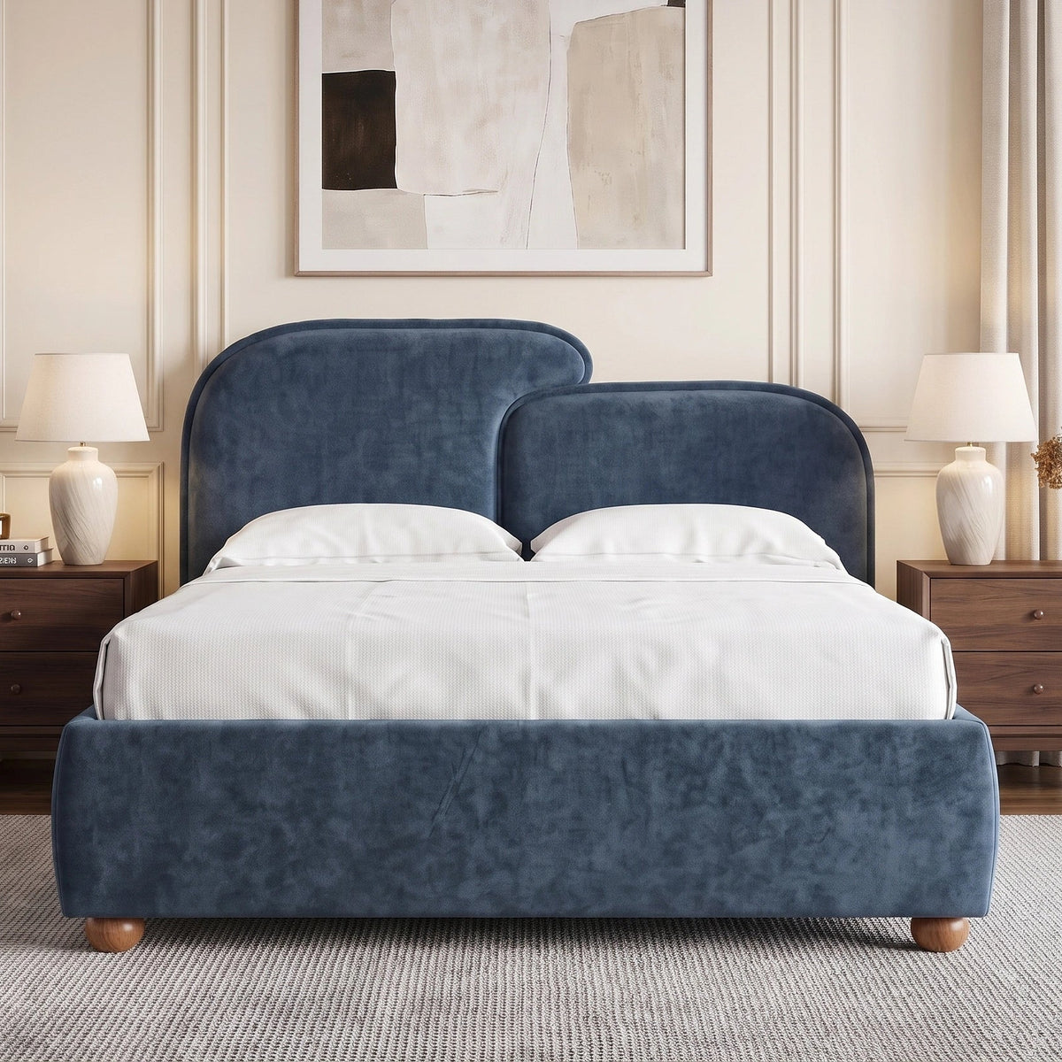[King | Blue] bed with gently split curved headboard and layered pillows arranged against a panelled wall