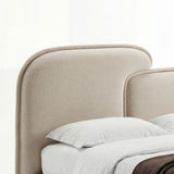 [King | Beige] Close-up of beige split headboard with stitched upholstery and gently curved upper edge of king bed frame