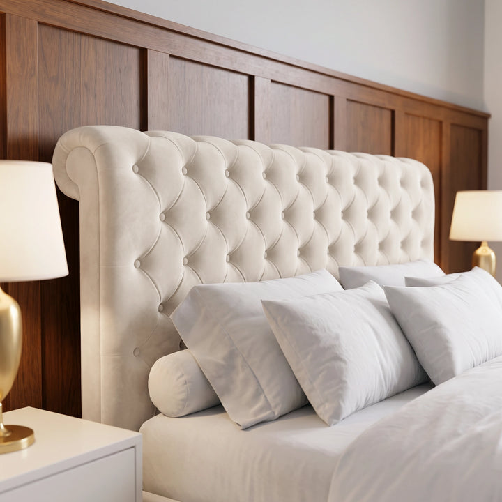 [King | Beige] Close-up of tufted headboard with button detail, white pillows, gold lamp, and wood panel wall
