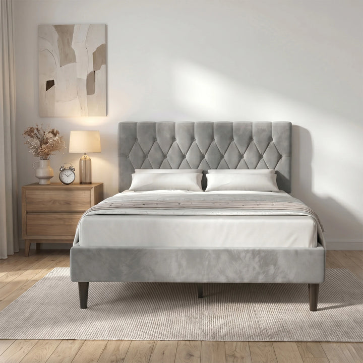 [King | Light Grey] Velvet Bed Frame front-on lifestyle view styled with warm lamp and oak side table