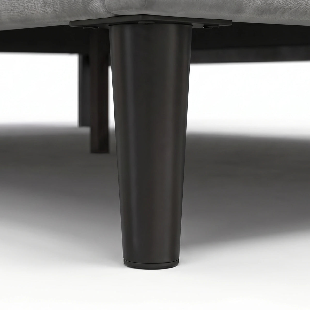 [King | Light Grey] Velvet Bed Frame close-up of tapered black metal leg with bolt-on fixing plate