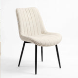[Vertical Beige | Clear] Kyvon beige upholstered fabric channeled stitched dining chair angled view with black metal legs