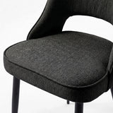 [Black] Close-up of Kyvon 4-seater black upholstered fabric comfy curve chair seat with black metal legs