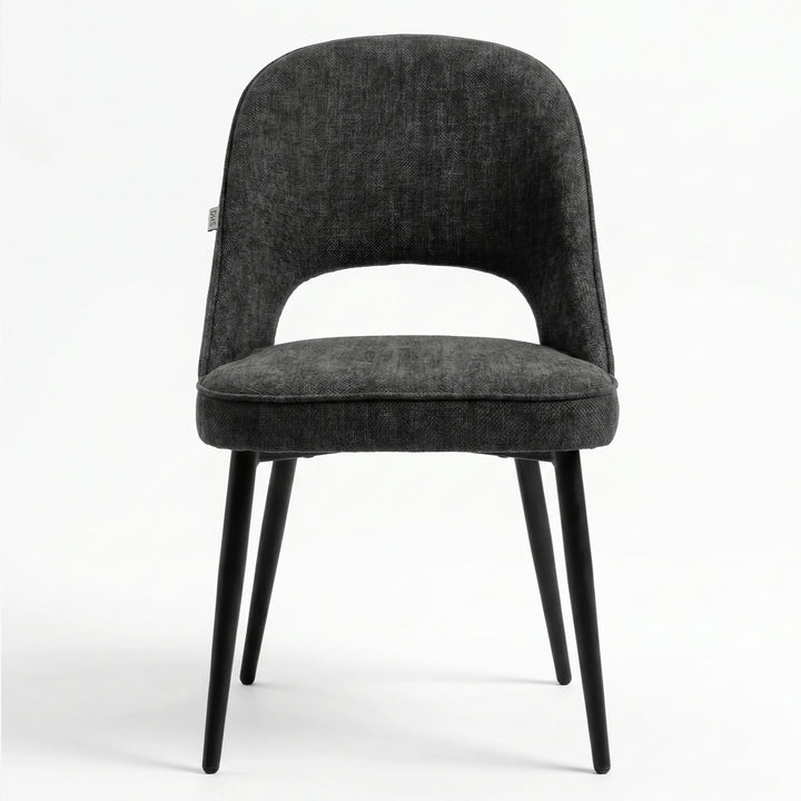 [Black | Tinted] Kyvon black upholstered fabric comfy dining chair front view with black metal legs