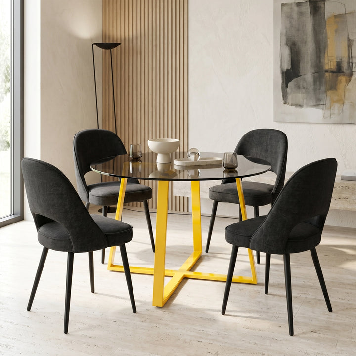 [Black | Tinted] Kyvon 4 seater round glass dining set with Tinted tabletop, gold legs and black chairs in a dining room