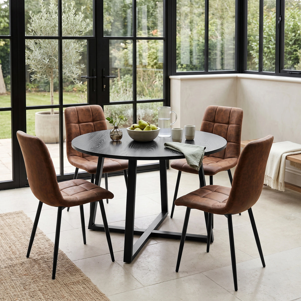 [Brown | Black Wood] Kyvon round dining table set in windowed dining area with four brown suede chairs