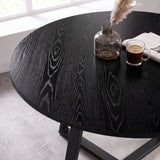 [Green | Black Wood] Close-up of Kyvon round dining table set's black wood-effect tabletop and black base