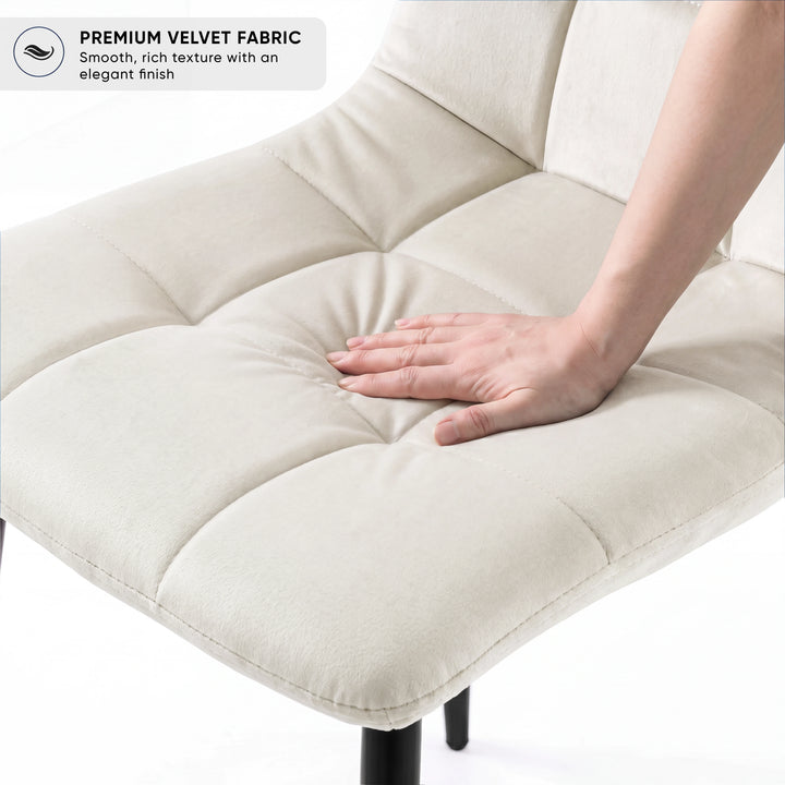 [Cream | Black Wood] Kyvon chair close-up: Premium Velvet Fabric, padded cream velvet tufted seat