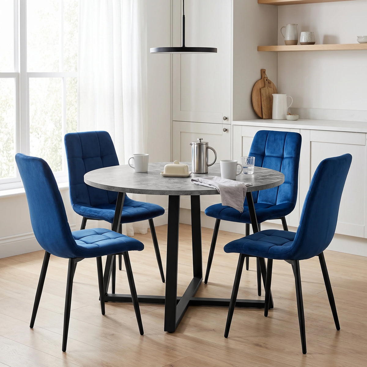 [Blue Velvet] Kyvon round dining table set with 4 blue velvet chairs in a styled room