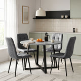[Grey Suede] Kyvon round dining table set with 4 grey suede chairs in a dining room