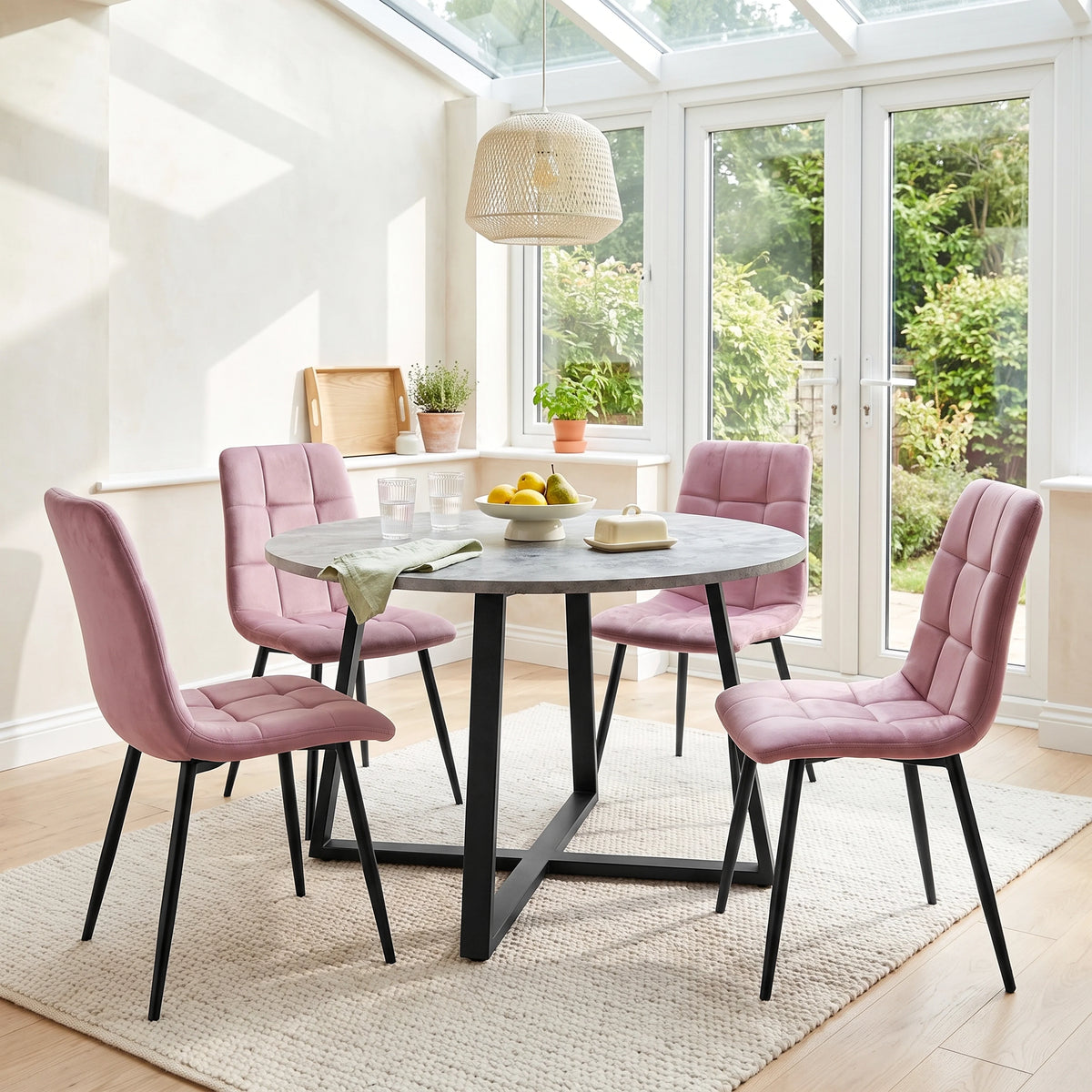 [Pink Velvet] Kyvon round dining table set with 4 pink velvet chairs in a dining room