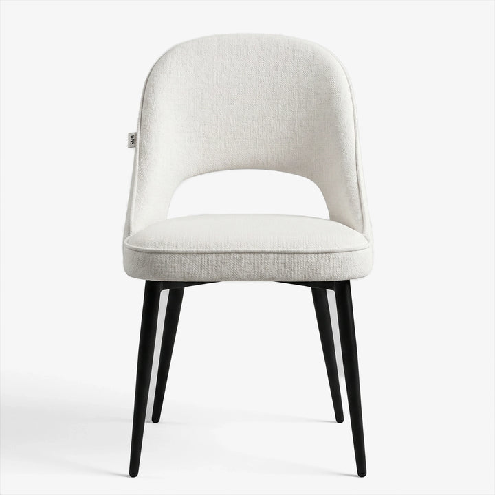 [Cream | Tinted] Kyvon cream upholstered fabric comfy dining chair front view with black metal legs