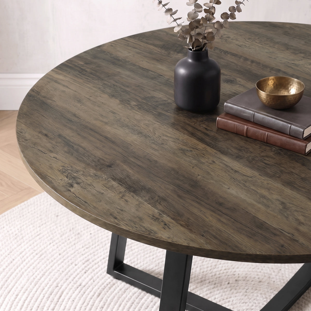 [Brown | Dark Wood] Close-up of Kyvon round dining table set's dark wood tabletop and black base