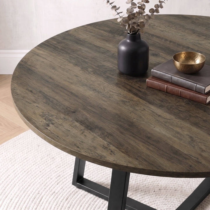 [Cream | Dark Wood] Close-up of Kyvon round dining table set's dark wood tabletop and black base