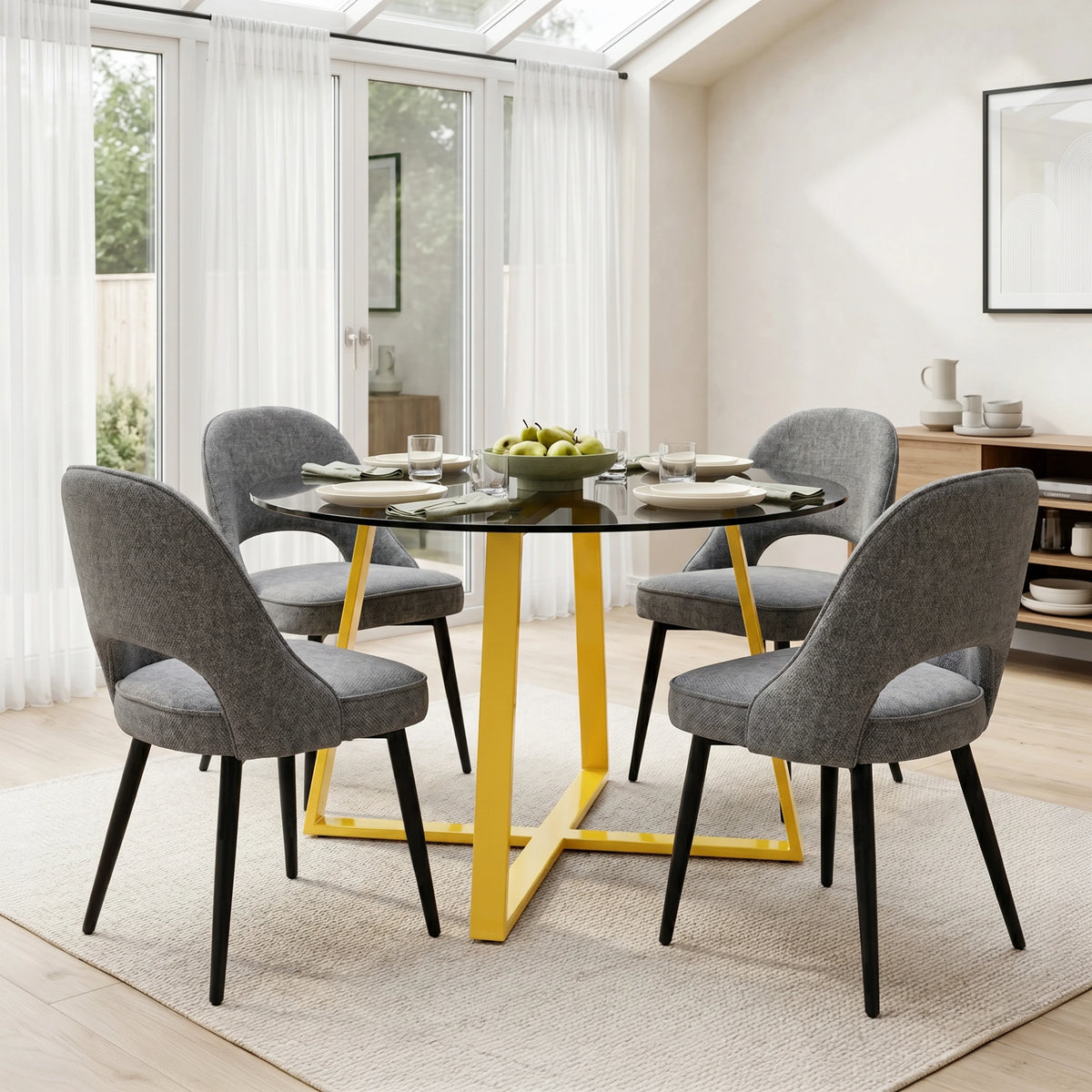 [Grey | Tinted] Kyvon 4 seater round glass dining set with Tinted tabletop, gold legs and grey chairs in a dining room