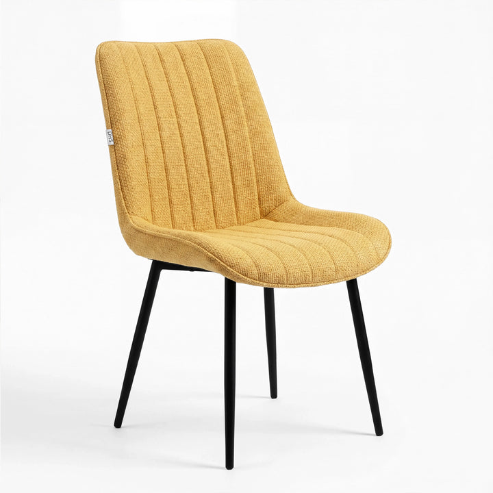 [Mustard] Kyvon mustard upholstered fabric vertical dining chair angled view with black metal legs