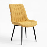 [Vertical Mustard | Clear] Kyvon mustard upholstered fabric channeled stitched dining chair angled view with black legs