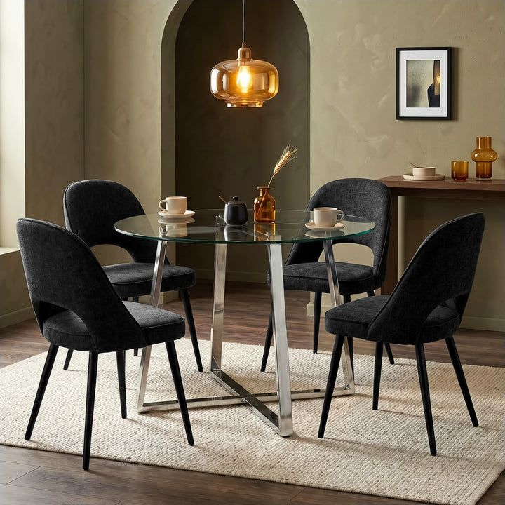 [Black] Kyvon round glass dining table set with comfy curvy chairs and chrome-finish iron legs in dining room