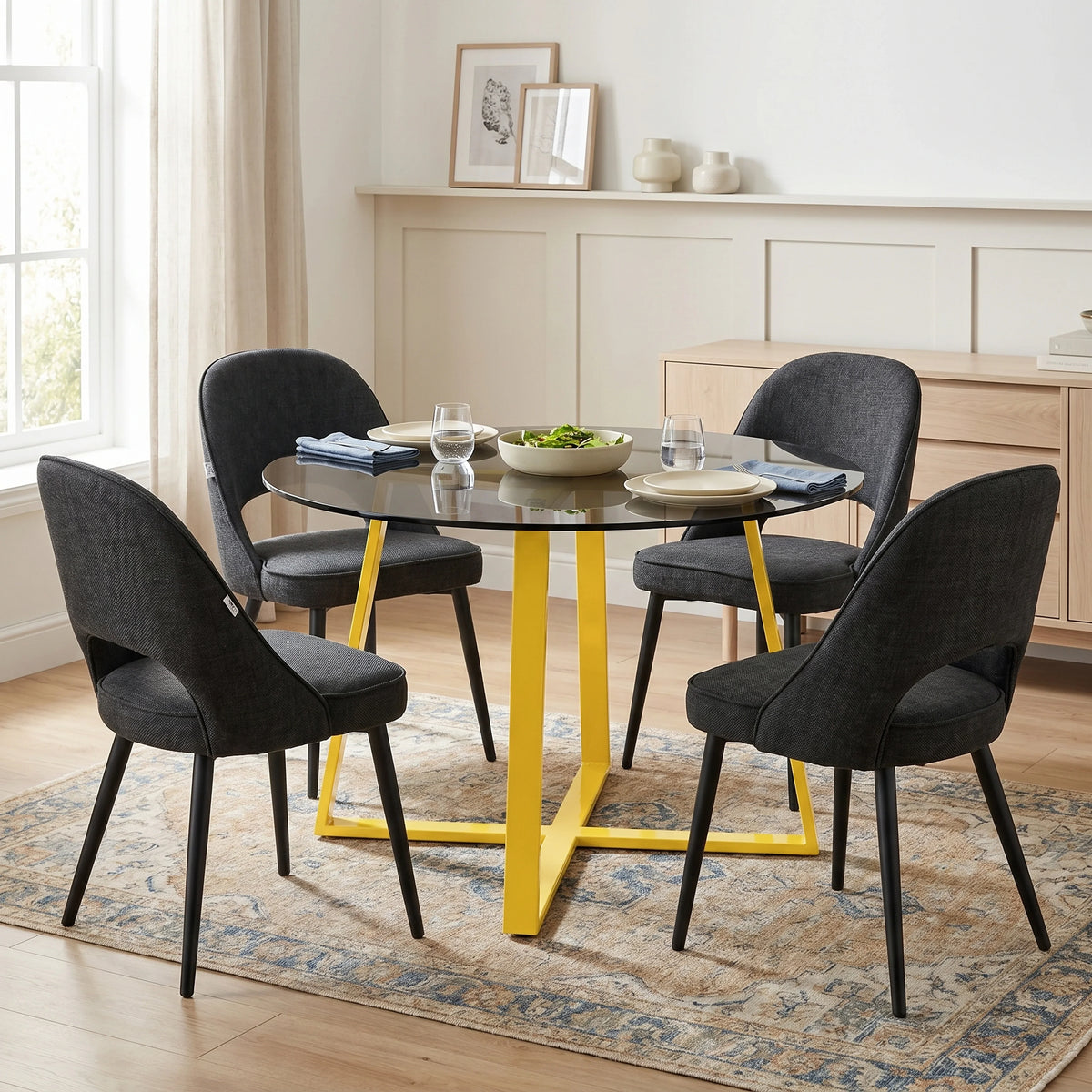 [Black | Tinted] Kyvon smoked round glass dining table set with 4 comfy curvy chairs and golden iron legs in dining room