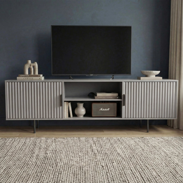 [Grey] Grey 180cm TV unit with vertical fluted side doors and central open shelf, TV mounted on dark navy wall.