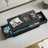 [Black] Overhead view of black storage coffee table with both side drawers extended showing books and magazine inside