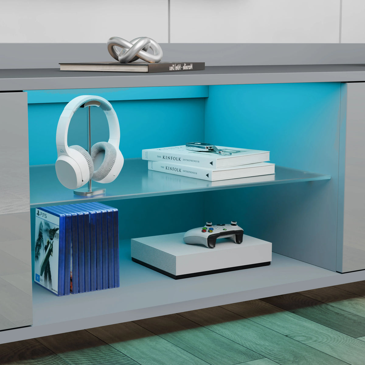[Grey] close-up of grey TV unit open central shelf with headphones, books and games console