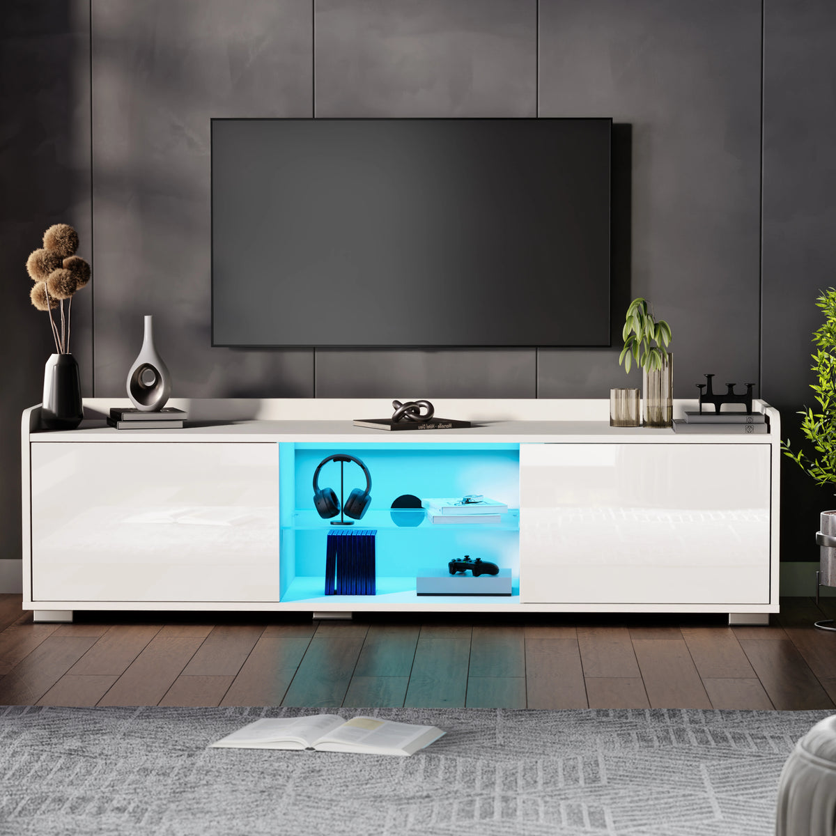 [White] white gloss LED TV cabinet against dark grey wall with decorative vase and books to the left
