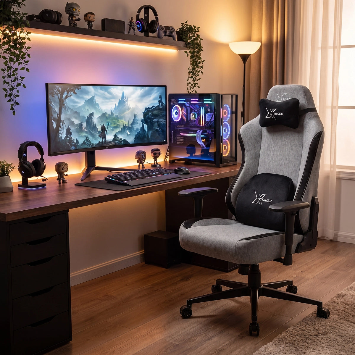 [Grey] modern gaming chair with black accents and built-in headrest and lumbar pillows, styled in a cozy home office setup next to a desk with dual monitors, gaming accessories, and ambient lighting.