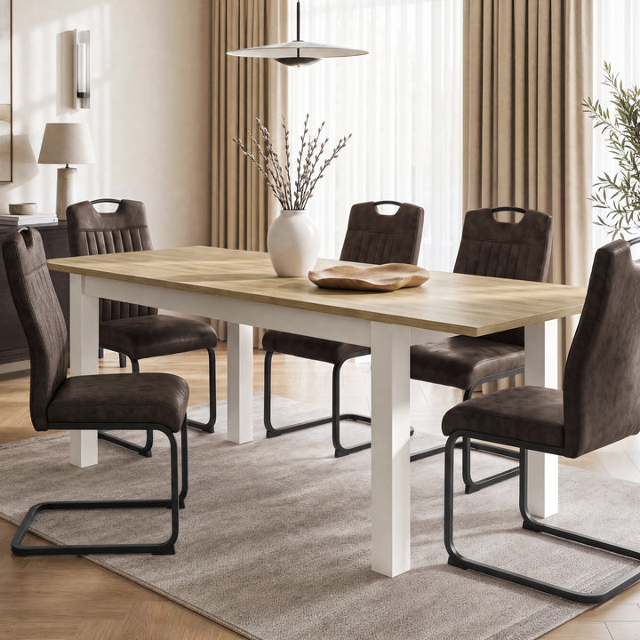 [160cm | Light Oak] Extended 200cm dining table with six brown chairs, Light Oak-effect top, white frame, vase and bowl.
