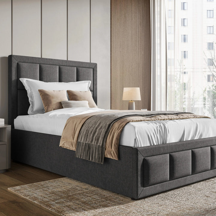 [Single | Dark Grey] Linen ottoman bed single angled view, 85cm headboard with grid stitching over channel storage base