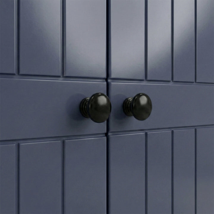 [Blue] Close-up brass round knob on Linra wardrobe drawer front showing grooved panel below