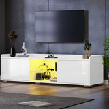 [White] white TV unit with both side flap doors open showing yellow-lit interior storage and decor on top