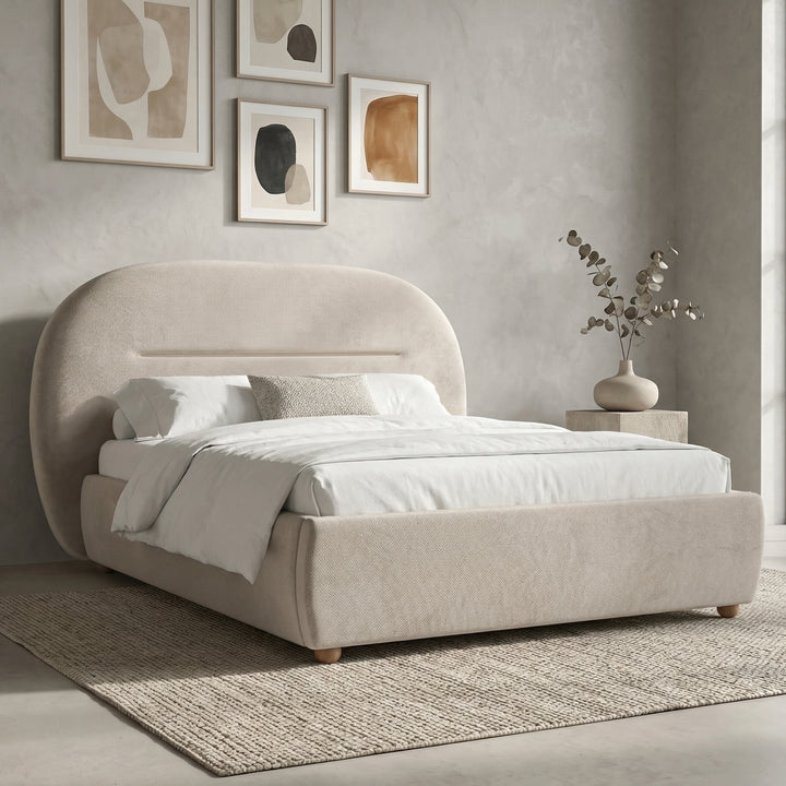 [Beige | Double] Side angle showing curved headboard silhouette and padded base with white linen duvet and accent cushion