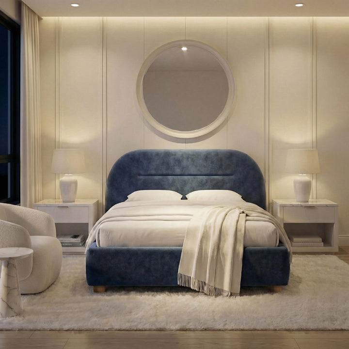 [Blue | Double] Moody evening shot of velvet upholstered bed with fringed throw in white bedroom with ambient lamp glow