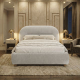 [Grey | King] Night-time styled room with brass mushroom lamps casting warm glow on upholstered bed and decorative panelling